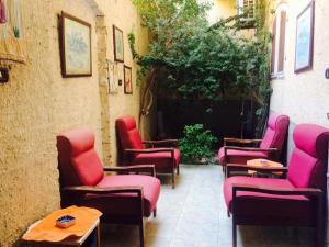 a group of chairs and tables on a patio at Sphinx in Al Karnak