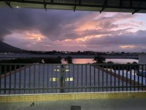 a view of a sunset from a balcony at Gạo homestay Dốc lết in My Luong