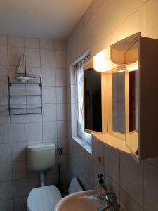 Et badeværelse på ferienhaus-am-scharmützelsee + 19 billeder