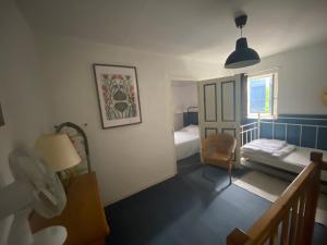 En eller flere senge i et værelse på La félicité