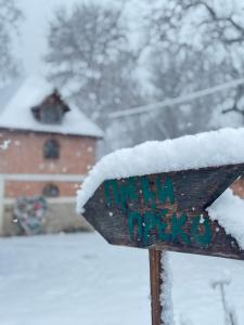 a snow covered sign in front of a building at River House in Belgrade