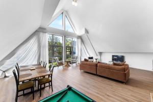 a living room with a pool table and a couch at Willa Monte in Zakopane