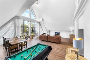 a living room with a pool table and a couch at Willa Monte in Zakopane +17 photos