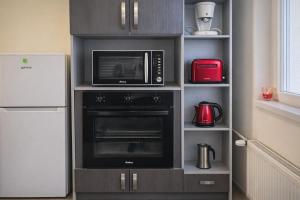 Køkken eller tekøkken på Comfort 66 Large Family City Home