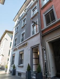 a building with a hotel recruiter sign on it at Hotel Kernhof Self Check-In in Zurich