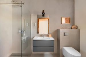 a bathroom with a sink and a shower and a toilet at Stodola Rybojady in Rybojady +39 photos