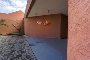a building with a sign that reads scotia villas at Soocha Villas in Yogyakarta