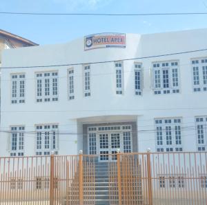 a white building with a sign that reads hotelaza at Hotel Apex in Srinagar