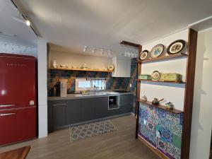 a kitchen with a sink and a counter top at Red Casa in Seogwipo