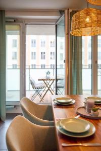 a dining room table with plates of food on it at Großzügiges Studio-Apartment in Dresden +8 photos