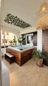 a large bathroom with a large bed in a room at La Belle Vue - Nouveau - Jacuzzi SPA Privé & Chauffé in Cabo Negro