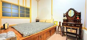 En eller flere senge i et værelse på 沐時光民宿