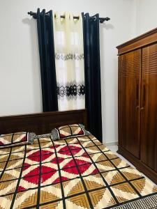 a bedroom with a bed and a dresser at moonlight villa in Weligama