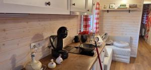 a kitchen with a counter top with a stove at Bambolina in Marche-en-Famenne