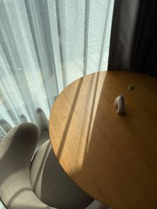 a wooden table in front of a window at Booze room in Ban Khlong Chi Lat +2 photos