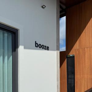 a sign on the side of a building with the word boogie on it at Booze room in Ban Khlong Chi Lat