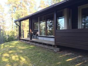 a screened in porch of a house at Loma-aika in Vierumäki