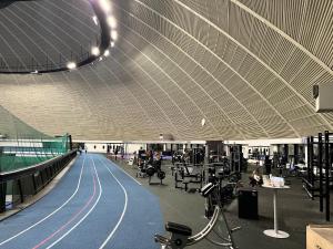 a large building with a large ceiling and a gym at Loma-aika in Vierumäki