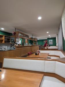 a large kitchen with a large island in a room at Hotel Shiva in Maingründel