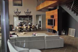 a living room with a couch and a dining room at Budzhaka Villa in Sozopol