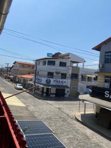 a street with a building on the side of the road at Apartamento Day in Ilhéus