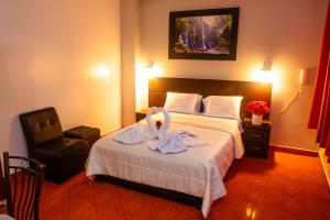 Giường trong phòng chung tại Hotel Mayros