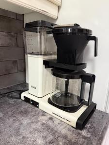 a black and white blender sitting on a counter at Nietos Aurora in Ylitornio