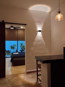 a bedroom with a bed and a view of the ocean at Muunyal Naj in Valladolid +11 photos