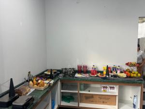 a kitchen with a counter with fruit on it at Pousada Lehmen in Santarém +12 photos