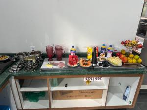 a counter top with a bunch of food on it at Pousada Lehmen in Santarém