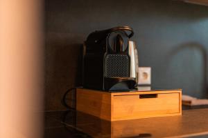 a telephone sitting on top of a wooden table at Tiny Boat House #6 in Garnwerd
