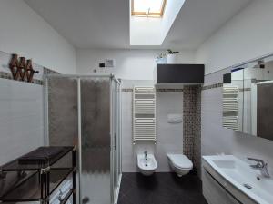 a bathroom with a shower and a toilet and a sink at Casa Scova, entire apartment in Garlasco +25 photos