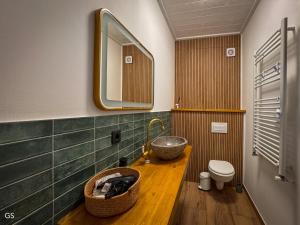 a bathroom with a sink and a mirror at Sunset Mountains Village in Dealu Negru +88 photos