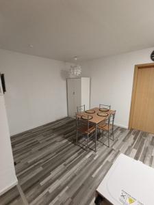 a room with a table and chairs in it at Praktische Monteurwohnung 2 Marl in Marl