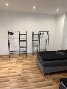 a room with a bed and two chairs in it at Praktische Monteurwohnung 2 Marl in Marl