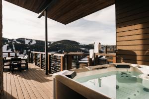 a bath tub sitting on top of a wooden deck at The Lookout in Winter Park