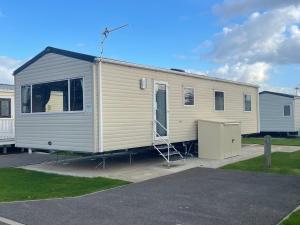 a mobile home is parked in a parking lot at Clearsands at Haven in Mablethorpe