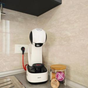 a white mixer sitting on a counter in a kitchen at 3-bedroom Sea View Home with Private Parking in Mokošica
