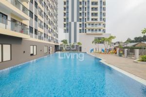 a swimming pool in the middle of a building at Narra Modern Living in Jakarta