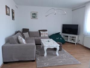 a living room with a couch and a coffee table at Esma 2 in Bihać