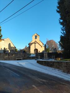a church on the side of a road at Le Grenier du Moulin in Darbonnay