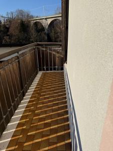 a walkway with a bridge in the background at Conveniente, tranquilla con parcheggio in Belluno +17 photos