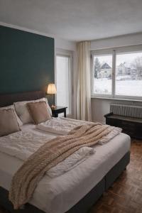 Un pat sau paturi într-o cameră la Haus am Bodensee