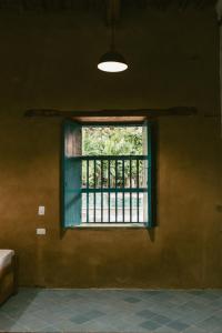a window in a room with a fence at Posada Los Tres Arrieros in Jordán
