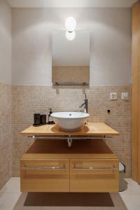 a bathroom with a sink and a mirror at Cornelia in Saas-Fee +43 photos