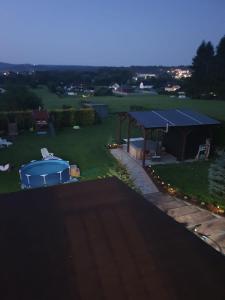 a backyard with a tent and a gazebo at Cichy Zakątek - Sauna Jacuzzi SPA RELAX SOLINA BIESZCZADY in Lesko
