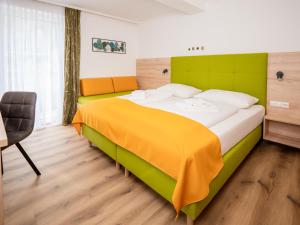 En eller flere senge i et værelse på Fischerhof Glinzner Hotel-Restaurant-Camping