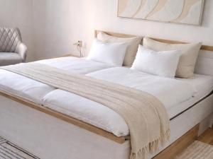 En eller flere senge i et værelse på Hübsche Unterkunft mit Parkplatz in Bad Muskau Nähe Schloss, Waldeisenbahn, Hermansbad, UNESCO Geopark, Nähe polnischer Markt, Top Lage für Ausflugsziele zum Wandern oder Radfahren