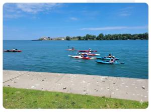a group of people in boats on the water at Charlotte Garden Bed and Breakfast in Niagara on the Lake +1 photo