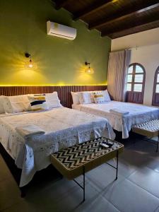 a bedroom with two beds in a room at Casa Marina Hotel Boutique in Ríohacha